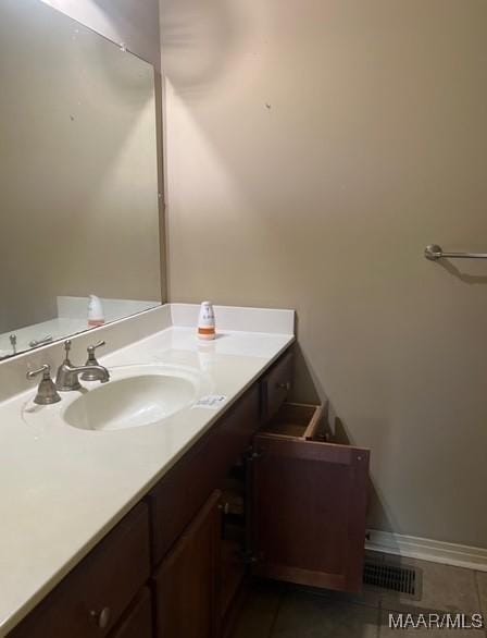 323 E Highland St, Dadeville, AL 36853 - bathroom featuring vanity and tile patterned flooring