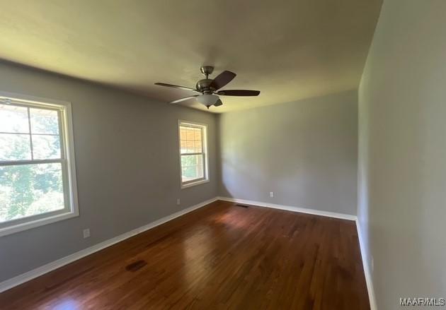 323 E Highland St, Dadeville, AL 36853 - spare room featuring wood finished floors and ceiling fan