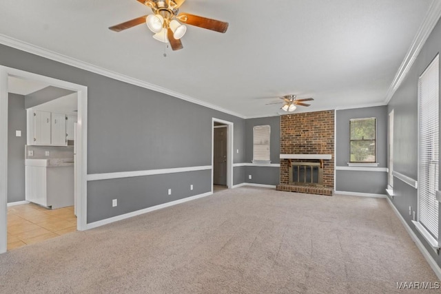 508 Ridgewood Ln, Montgomery, AL 36109 - unfurnished living room featuring ceiling fan, carpet, ornamental molding, a brick fireplace, and tile patterned flooring