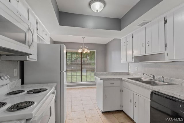 508 Ridgewood Ln, Montgomery, AL 36109 - kitchen featuring white appliances, light countertops, light tile patterned floors, a chandelier, and white cabinets