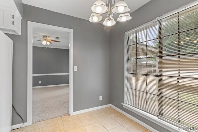 508 Ridgewood Ln, Montgomery, AL 36109 - unfurnished room featuring a ceiling fan, a chandelier, light tile patterned floors, and light colored carpet
