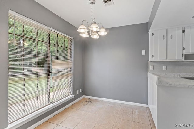 508 Ridgewood Ln, Montgomery, AL 36109 - unfurnished dining area featuring a chandelier and light tile patterned floors