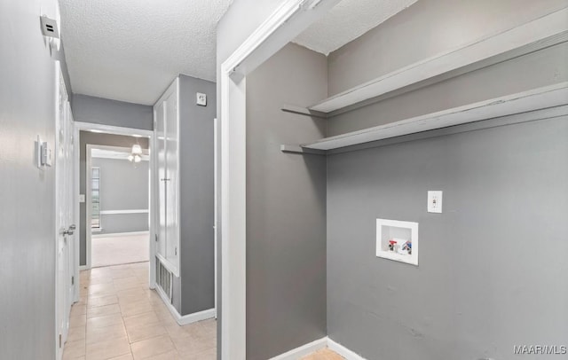 508 Ridgewood Ln, Montgomery, AL 36109 - washroom featuring hookup for a washing machine, a textured ceiling, and light tile patterned floors
