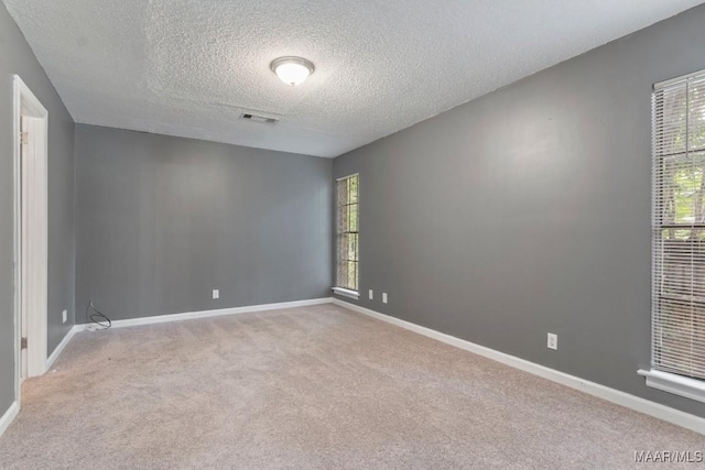 508 Ridgewood Ln, Montgomery, AL 36109 - empty room with a textured ceiling and light carpet