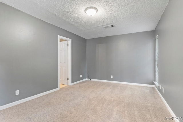 508 Ridgewood Ln, Montgomery, AL 36109 - unfurnished room with a textured ceiling and light carpet