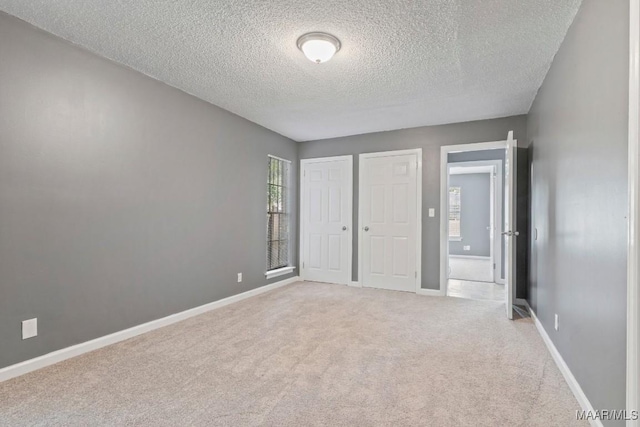508 Ridgewood Ln, Montgomery, AL 36109 - unfurnished bedroom with a textured ceiling and light carpet