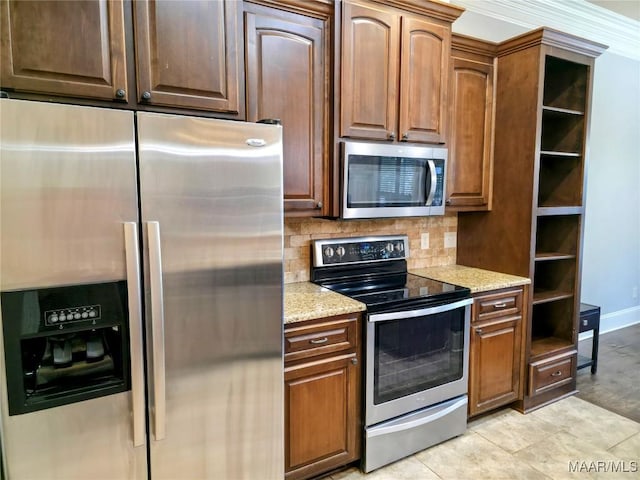 134 Southern Hills Rdg, Wetumpka, AL 36093 - kitchen with appliances with stainless steel finishes, open shelves, decorative backsplash, light stone counters, and light tile patterned flooring