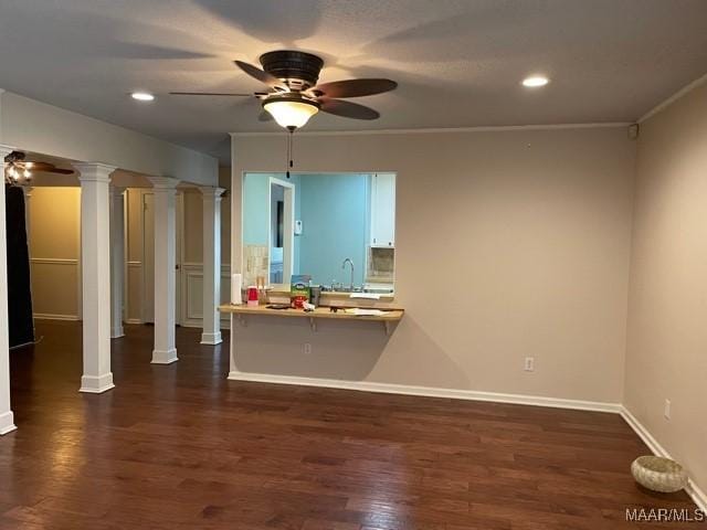4447 Wares Ferry Rd, Montgomery, AL 36109 - unfurnished living room featuring ceiling fan, decorative columns, dark wood-style floors, recessed lighting, and crown molding