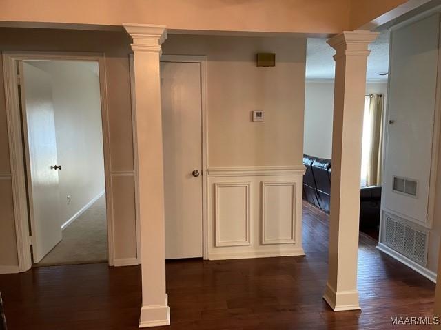 4447 Wares Ferry Rd, Montgomery, AL 36109 - hall with decorative columns and dark wood finished floors