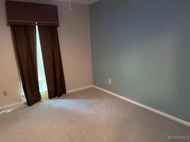 4447 Wares Ferry Rd, Montgomery, AL 36109 - carpeted empty room with baseboards