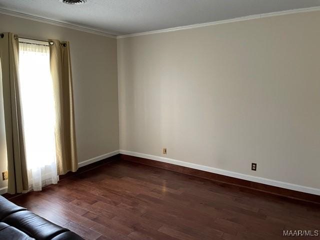 4447 Wares Ferry Rd, Montgomery, AL 36109 - spare room featuring dark wood-style flooring and ornamental molding