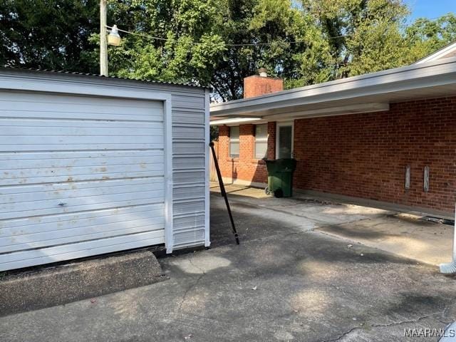 4447 Wares Ferry Rd, Montgomery, AL 36109 - garage featuring a shed