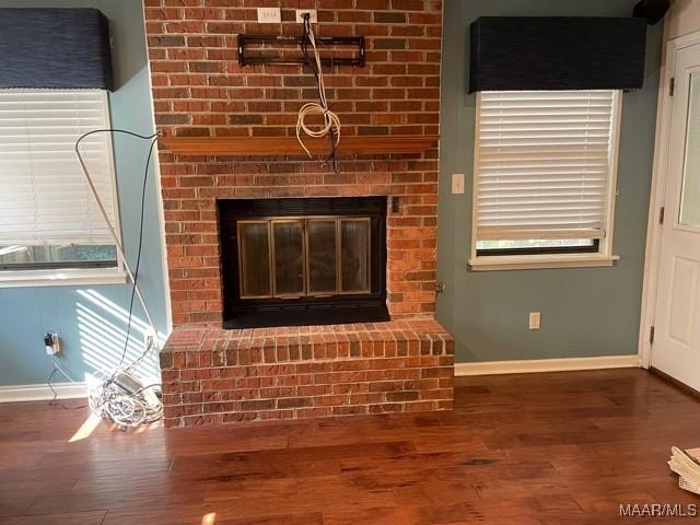 4447 Wares Ferry Rd, Montgomery, AL 36109 - detailed view of wood finished floors and a brick fireplace