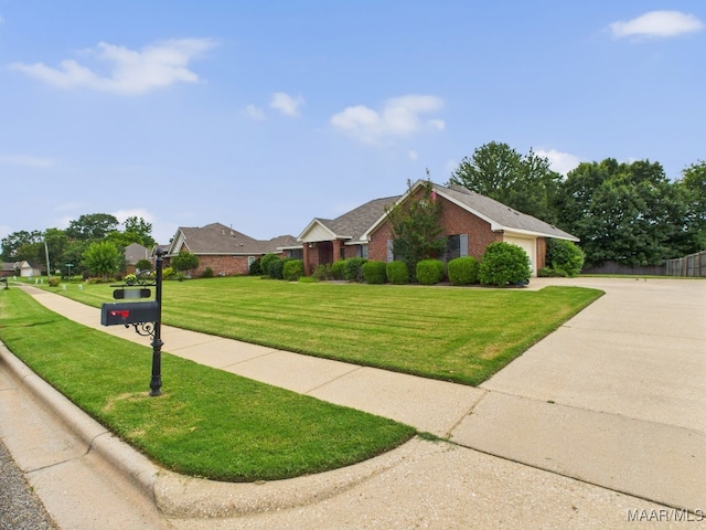 508 Mossy Oak Rdg, Prattville, AL 36066 - view of front facade with brick siding, an attached garage, a front yard, and concrete driveway