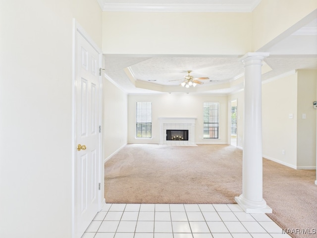 508 Mossy Oak Rdg, Prattville, AL 36066 - unfurnished living room featuring light colored carpet, a ceiling fan, crown molding, decorative columns, and a raised ceiling
