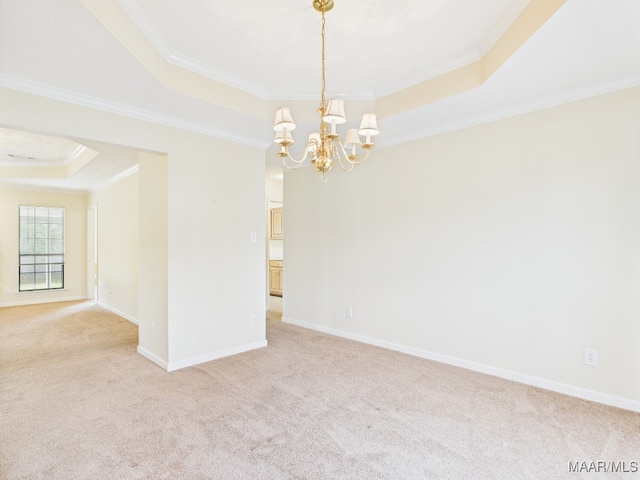 508 Mossy Oak Rdg, Prattville, AL 36066 - spare room featuring a tray ceiling, ornamental molding, a chandelier, and light carpet