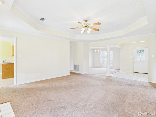 508 Mossy Oak Rdg, Prattville, AL 36066 - unfurnished living room with a tray ceiling, a ceiling fan, a chandelier, light colored carpet, and ornamental molding