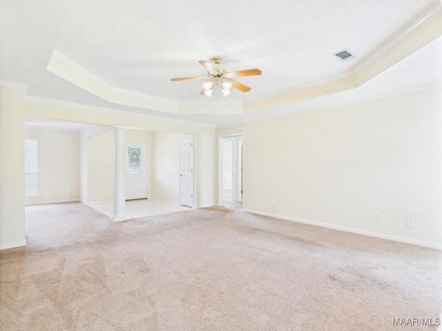 508 Mossy Oak Rdg, Prattville, AL 36066 - spare room featuring a tray ceiling, ornate columns, ornamental molding, and light colored carpet