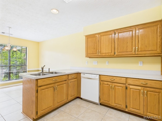508 Mossy Oak Rdg, Prattville, AL 36066 - kitchen with white dishwasher, a peninsula, light tile patterned floors, light countertops, and a textured ceiling