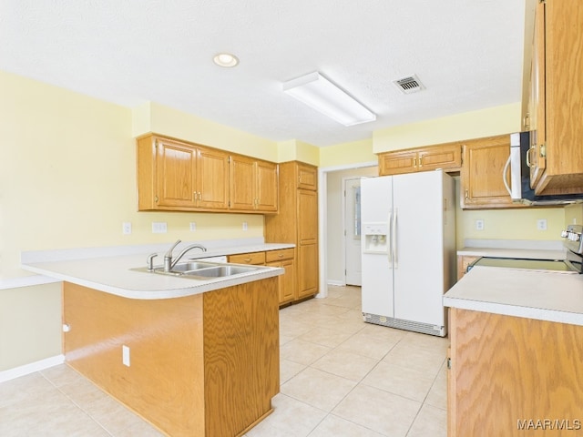 508 Mossy Oak Rdg, Prattville, AL 36066 - kitchen with white fridge with ice dispenser, a peninsula, range, stainless steel microwave, and light countertops