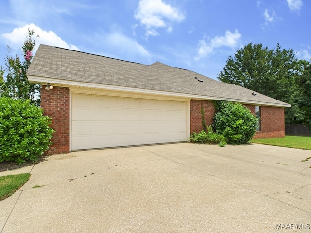 508 Mossy Oak Rdg, Prattville, AL 36066 - view of front of house with brick siding, concrete driveway, an attached garage, and roof with shingles