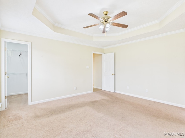 508 Mossy Oak Rdg, Prattville, AL 36066 - spare room with a tray ceiling, crown molding, light colored carpet, and a ceiling fan