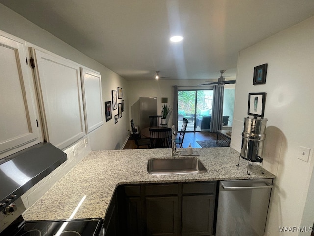 1061 Stonegate Dr Unit C, Auburn, AL 36832 - kitchen with dishwasher, ceiling fan, light stone countertops, and a peninsula