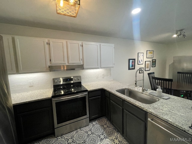1061 Stonegate Dr Unit C, Auburn, AL 36832 - kitchen with appliances with stainless steel finishes, under cabinet range hood, backsplash, and white cabinets