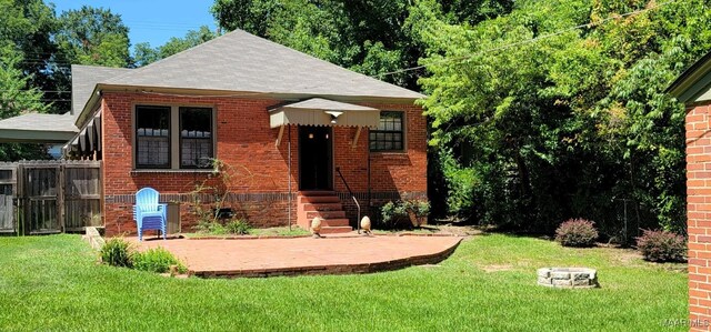 1928 Winona Ave, Montgomery, AL 36107 - bungalow featuring brick siding, roof with shingles, and a patio area