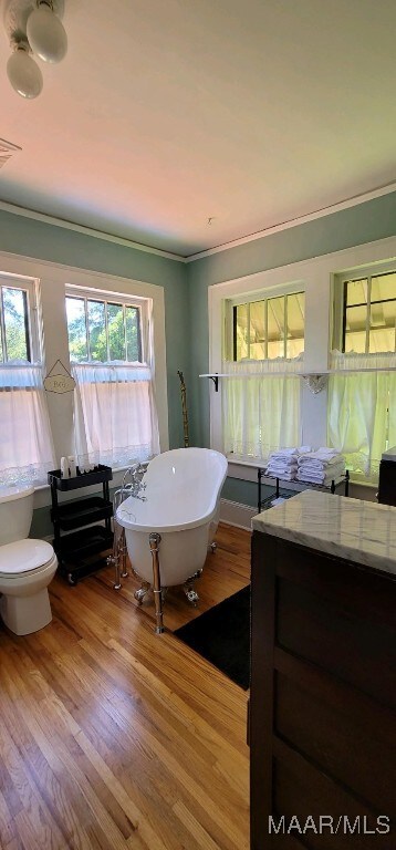 1928 Winona Ave, Montgomery, AL 36107 - full bath featuring a freestanding bath, wood finished floors, and crown molding