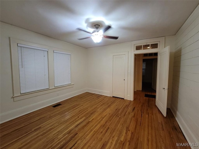 1928 Winona Ave, Montgomery, AL 36107 - unfurnished bedroom featuring wood finished floors, ceiling fan, and a closet