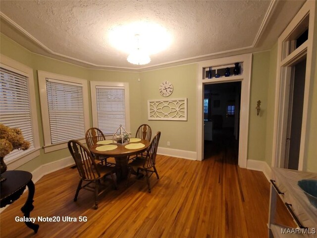 1928 Winona Ave, Montgomery, AL 36107 - dining space with a textured ceiling and light wood-style floors