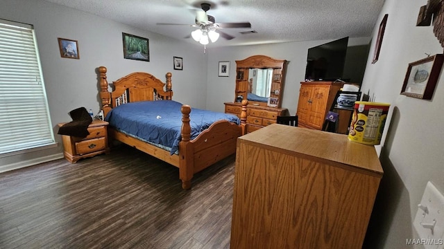 1345 Firetower Rd, Wetumpka, AL 36092 - bedroom featuring dark wood-type flooring, a textured ceiling, and ceiling fan