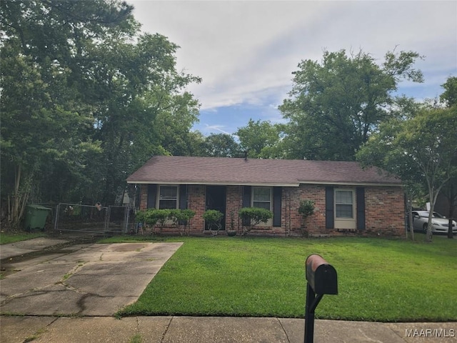 5118 Greensboro Dr, Montgomery, AL 36108 - view of front of property featuring a gate, brick siding, and a front yard