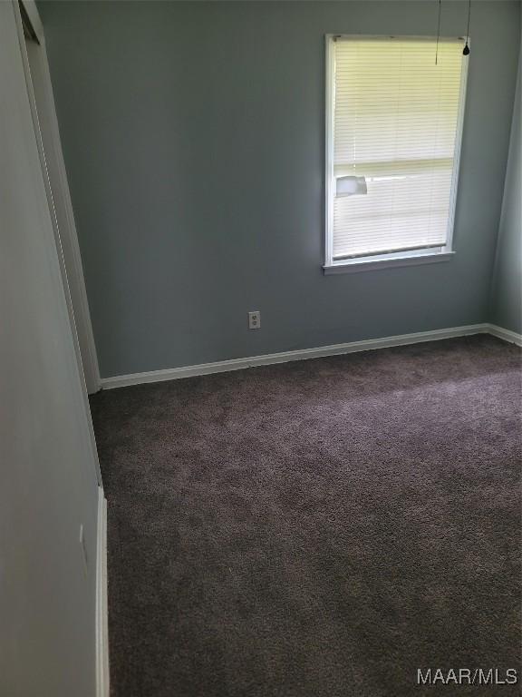 5118 Greensboro Dr, Montgomery, AL 36108 - empty room featuring dark colored carpet