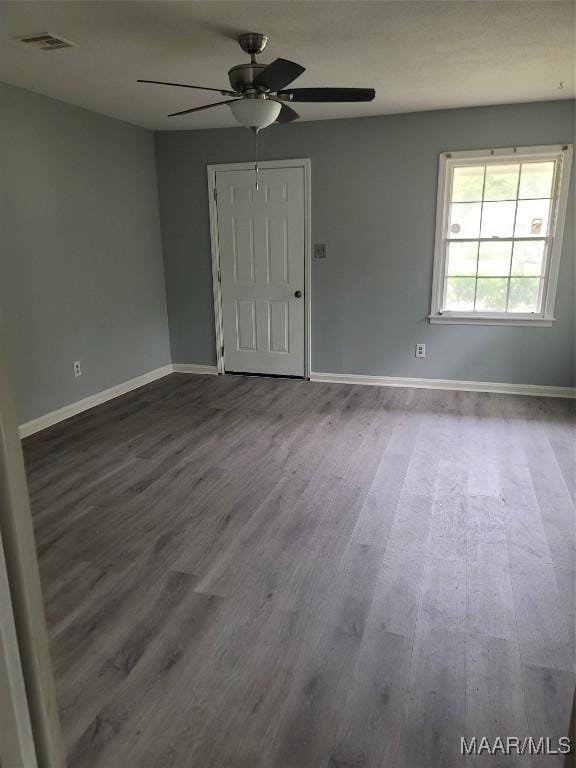 5118 Greensboro Dr, Montgomery, AL 36108 - empty room with dark wood finished floors and a ceiling fan