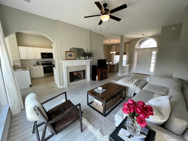 2495 Chancellor Ridge Rd, Prattville, AL 36066 - living area featuring light wood-style floors, arched walkways, and a ceiling fan