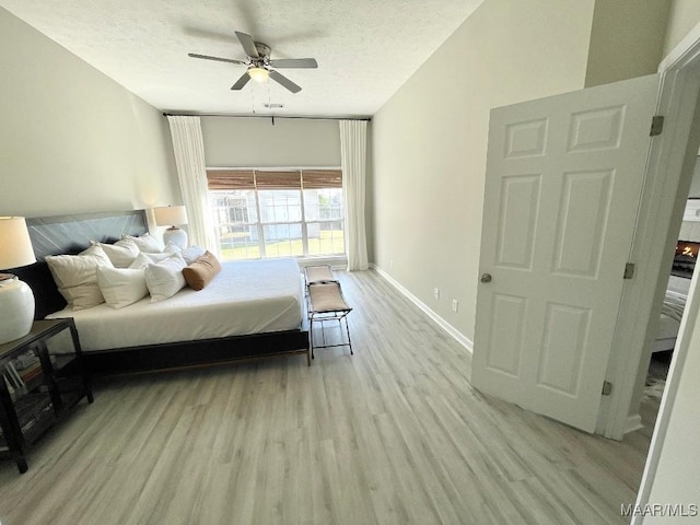 2495 Chancellor Ridge Rd, Prattville, AL 36066 - bedroom featuring wood finished floors, a textured ceiling, and ceiling fan