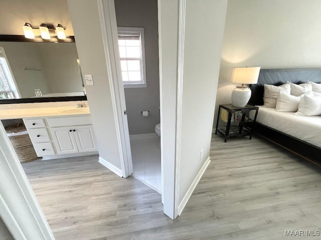 2495 Chancellor Ridge Rd, Prattville, AL 36066 - bedroom with light wood-style flooring and ensuite bath