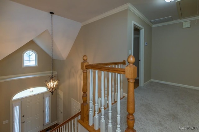 240 Winding Wood Dr, Wetumpka, AL 36093 - carpeted entrance foyer with a chandelier and crown molding