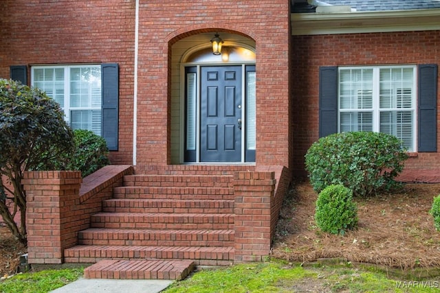 240 Winding Wood Dr, Wetumpka, AL 36093 - view of exterior entry featuring brick siding