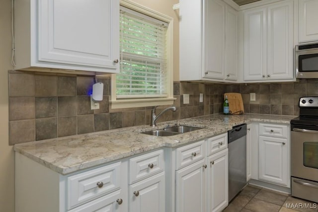 240 Winding Wood Dr, Wetumpka, AL 36093 - kitchen featuring appliances with stainless steel finishes, white cabinets, and backsplash