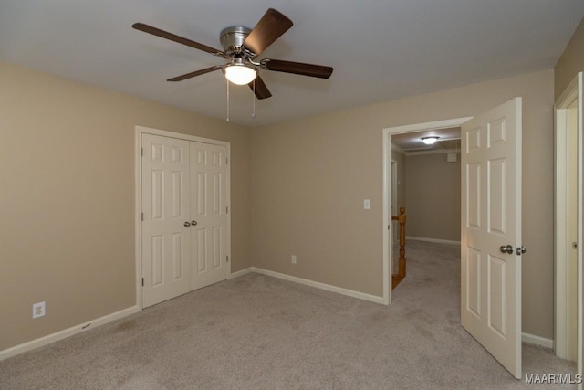240 Winding Wood Dr, Wetumpka, AL 36093 - unfurnished bedroom with light colored carpet, a closet, and ceiling fan