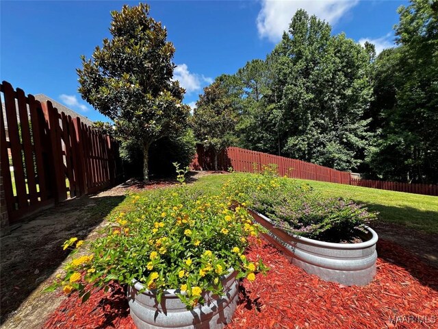 309 Southern Hills Dr, Wetumpka, AL 36093 - fenced backyard featuring a vegetable garden