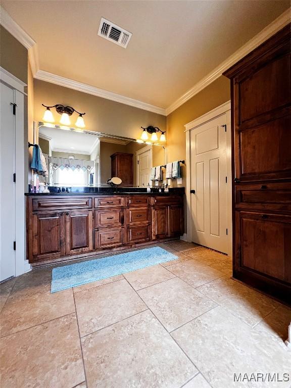 309 Southern Hills Dr, Wetumpka, AL 36093 - bathroom with ornamental molding, double vanity, and tile patterned flooring