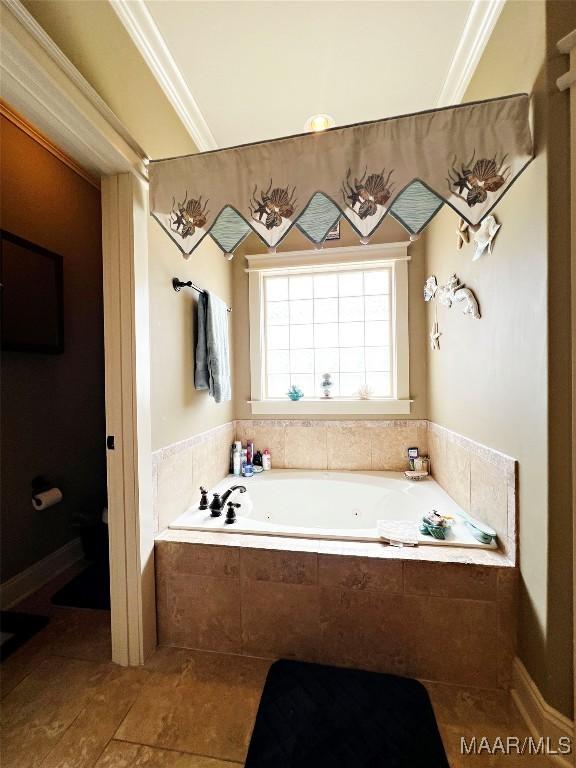 309 Southern Hills Dr, Wetumpka, AL 36093 - bathroom featuring a tub with jets, ornamental molding, and tile patterned floors