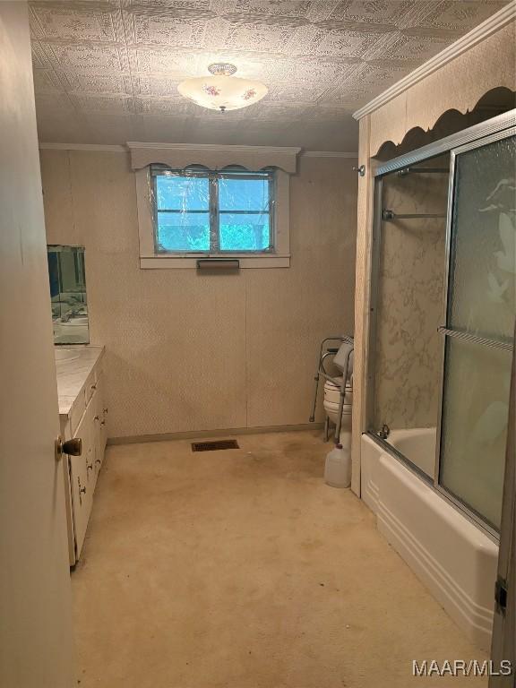 407 Powers Ave, Tallassee, AL 36078 - bathroom with ornamental molding, combined bath / shower with glass door, vanity, and an ornate ceiling