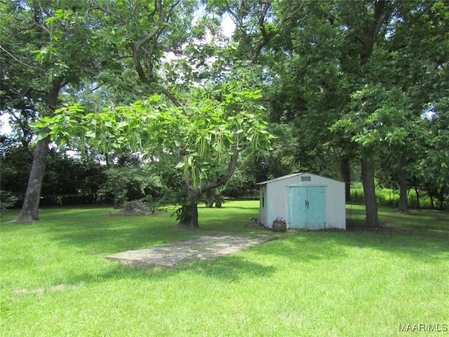 1716 Old Federal Rd, Shorter, AL 36075 - view of grassy yard with a storage unit