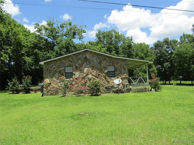 1716 Old Federal Rd, Shorter, AL 36075 - view of front of property with stone siding, a front yard, and covered porch