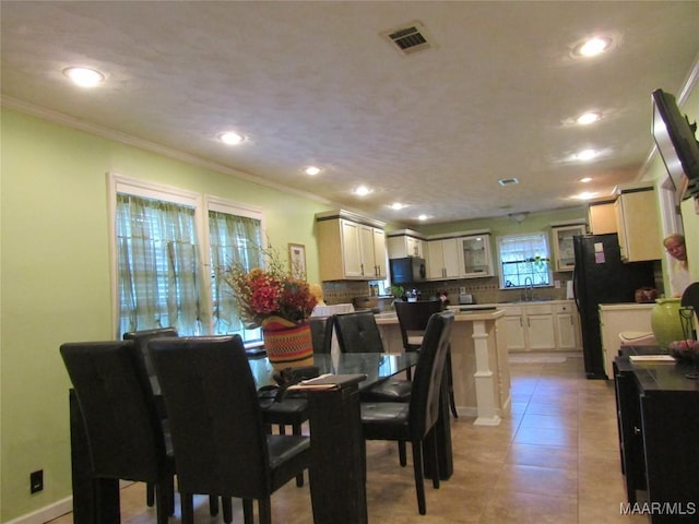 1716 Old Federal Rd, Shorter, AL 36075 - dining room with crown molding, recessed lighting, and light tile patterned flooring